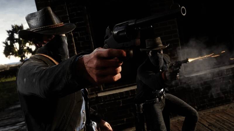 R星游戏工作室内部工作场景，团队成员正在专注讨论项目细节