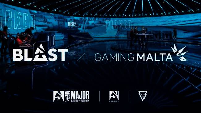 BLAST与马耳他政府签署合作协议现场，双方代表握手合影，背景为马耳他国旗与BLAST标志