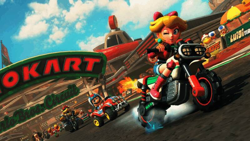 《马里奥赛车：世界》游戏画面，展示卡通风格赛道与角色