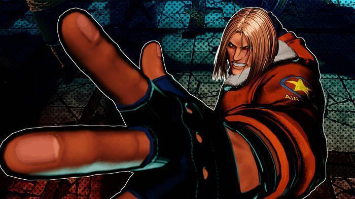 松原健二在SNK发布会现场讲话的照片，背景为《饿狼传说》宣传海报