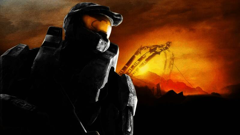 《光环3》经典画面回顾，展现主角士官长手持武器站在悬崖边缘俯瞰战场