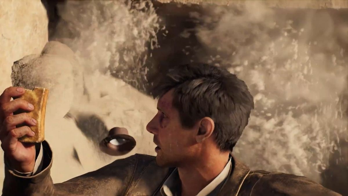 琼斯站在巨大地下洞穴中仰望穹顶，石柱林立，瀑布从高处倾泻而下