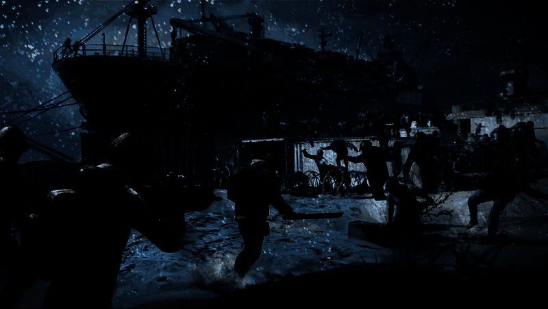 张志磊身穿战斗装甲，手持重型武器站立于废墟之上，背景为燃烧的营地