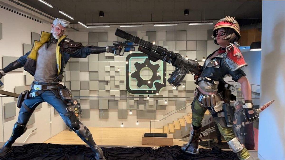 《无主之地4》官方LOGO展示图，背景为焦土地貌与爆炸特效，风格狂野炫酷