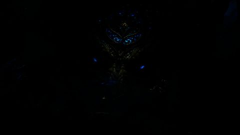 大河神·达温首次现身场景，巨大神影矗立于沙海之上，水流与烈焰环绕周身，展现其神圣而威严的气质