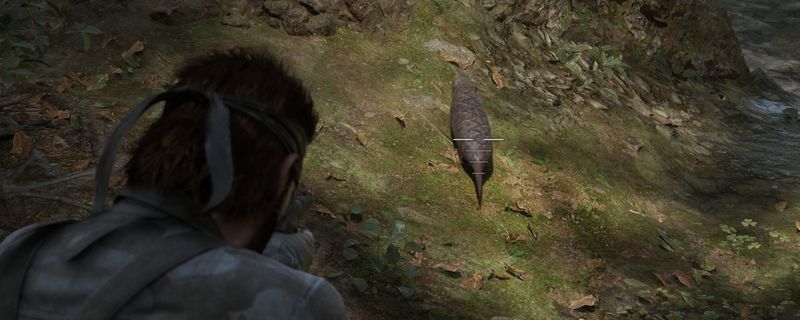 《合金装备3：重制版》中土龙的特写画面，呈现其类似蚯蚓但带有鳞片的独特生物形态