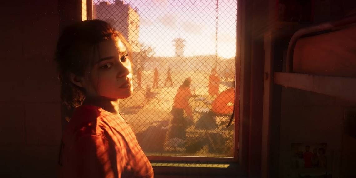 施特劳斯·泽尔尼克在公开场合发言的画面，神情严肃，背景为Take-Two公司标志与游戏画面投影