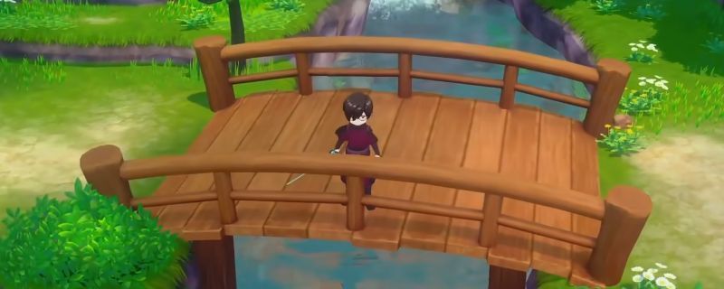 《牧场物语 来吧！风之繁华集市》中玩家在湖边使用黄金鱼竿垂钓的场景，水面泛起涟漪，显示即将有大型鱼类上钩