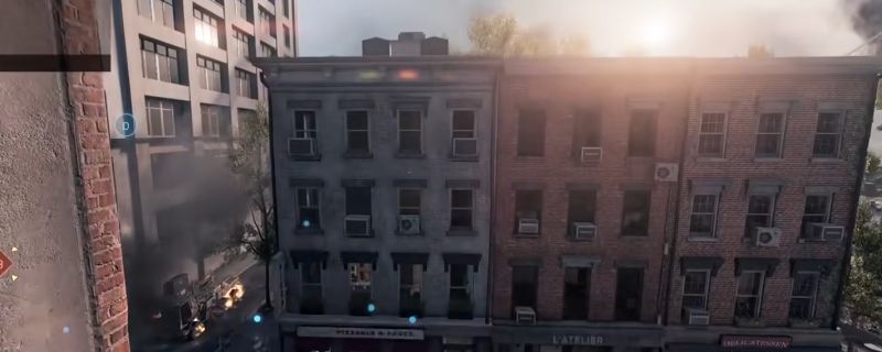 《战地6》帝国之州地图中玩家接近高楼边缘准备开伞飞行的视角，下方为密集城市街道