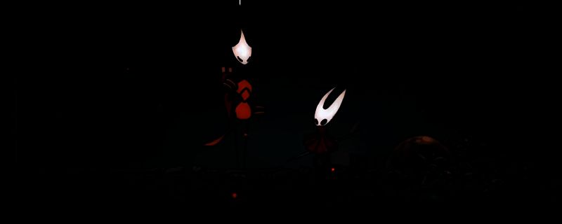 空洞骑士：丝之歌游戏画面，展示角色在神秘洞穴中探索的场景，背景充满奇异生物与复杂地形