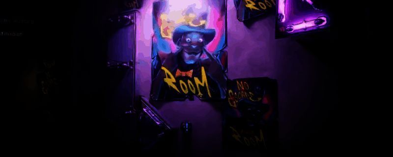 《无主之地4》中密室逃脱任务入口场景，昏暗走廊尽头闪烁红光的控制台