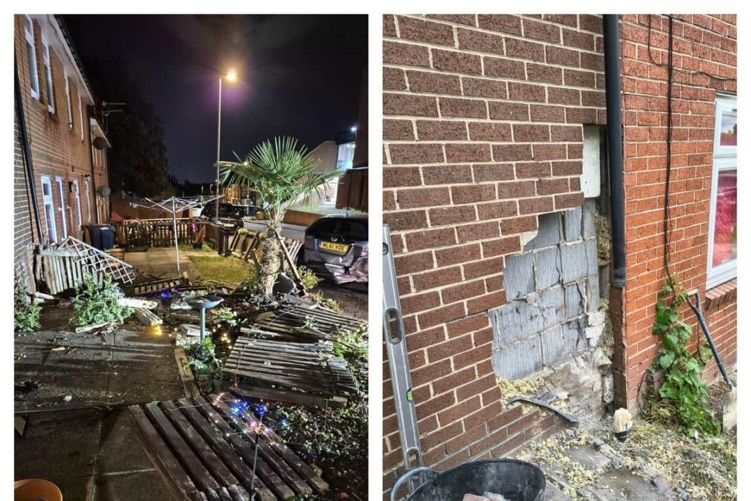 被撞房屋内部景象，家具损毁，墙壁裂开，现场一片狼藉