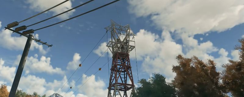 《消逝的光芒：困兽》游戏中加油站高压电线杆安全点实景图，铁塔高耸，周围布满废弃车辆与围栏，电力设备闪烁微光